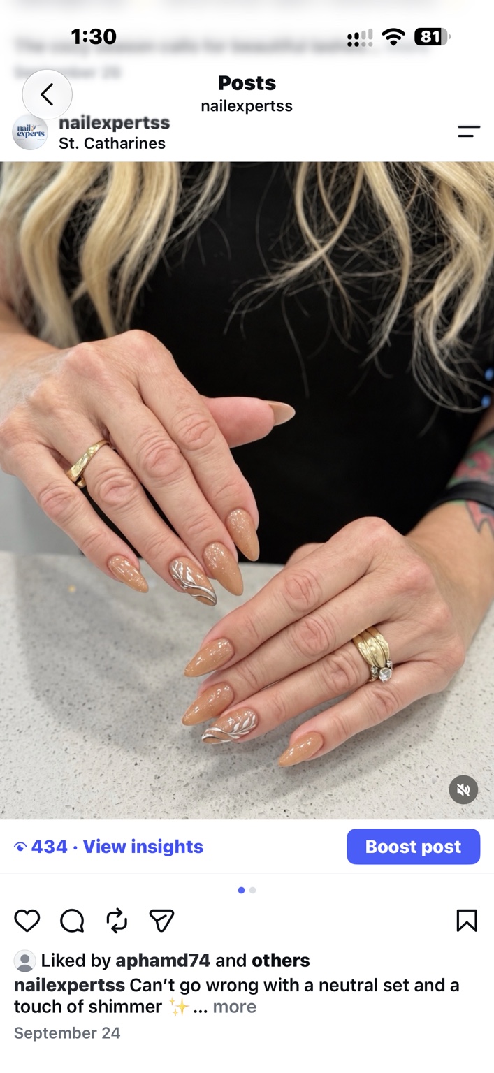 Nude almond manicure with shimmer and silver accents, by Nail Experts St. Catharines